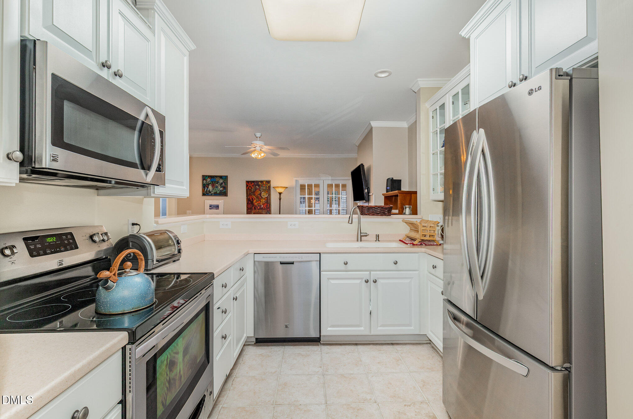 2541 Forest Shadows Lane Raleigh, NC 27614 - Photo 6 of 23 a kitchen with a refrigerator stove and sink