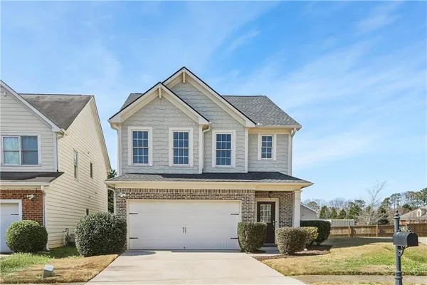 a front view of a house with a space