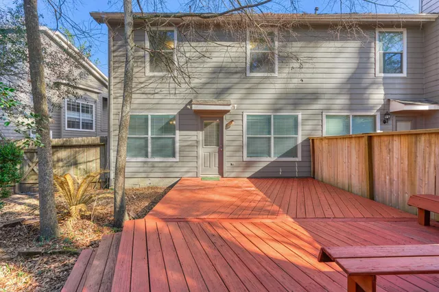 a backyard of a house with wooden floor
