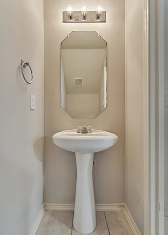 a kitchen with a sink appliances and cabinets