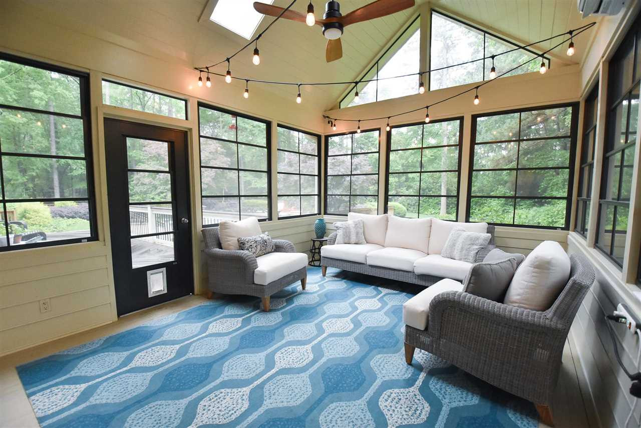 313 Jellison Court Raleigh, NC 27615 - Photo 11 of 30 Screened Porch with EZ Breeze windows, skylights, and ceiling fan. Screened Porch