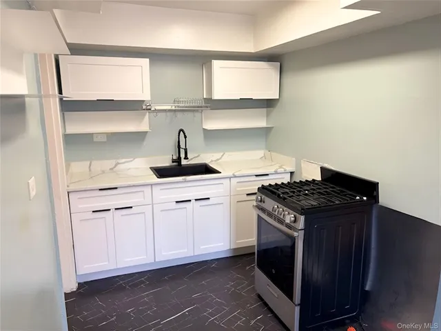 a kitchen with a stove and a sink