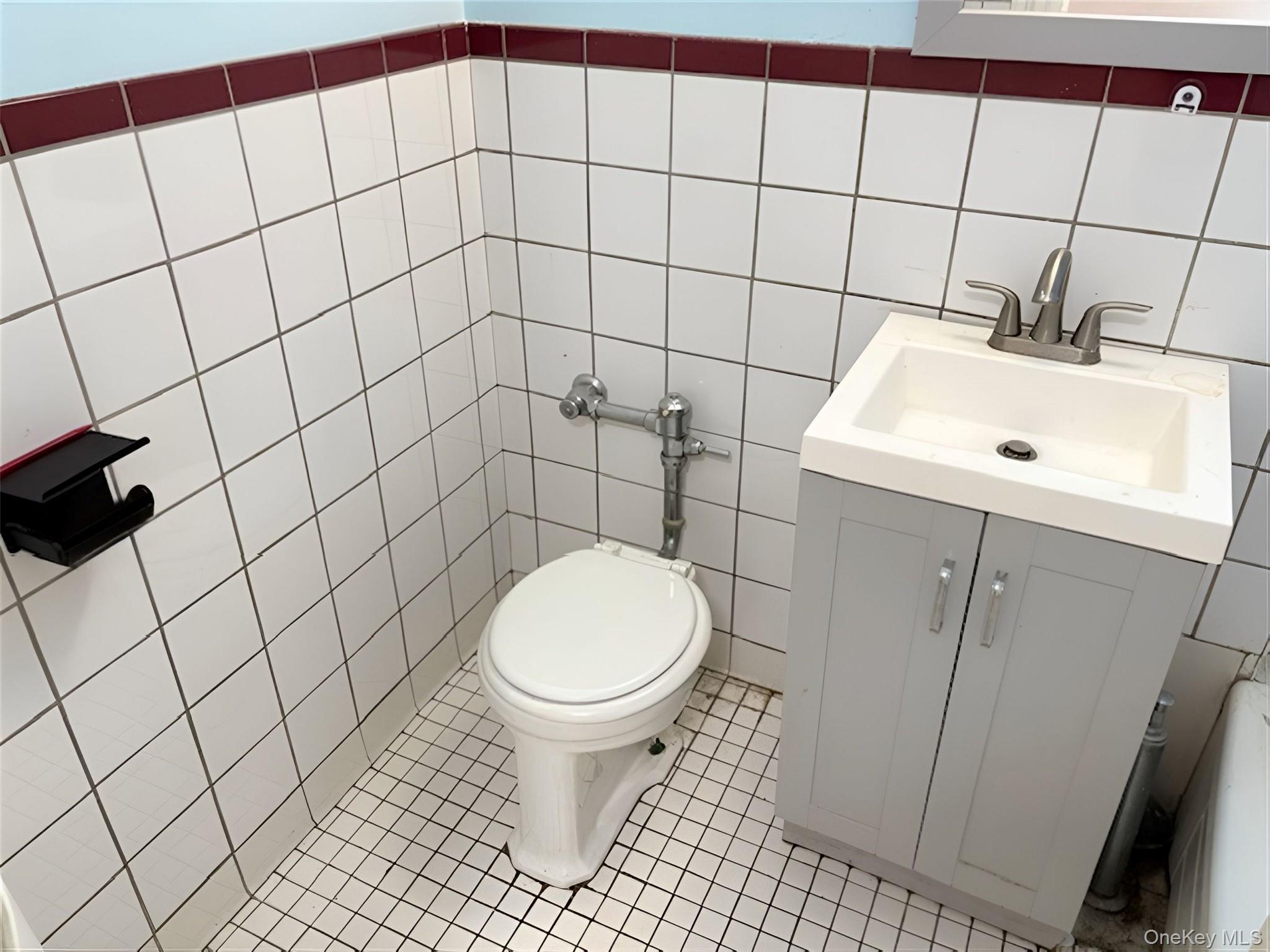 152-72 Melbourne Avenue, Unit 1D Queens, NY 11367 - Photo 8 of 14 a bathroom with a sink toilet and shower