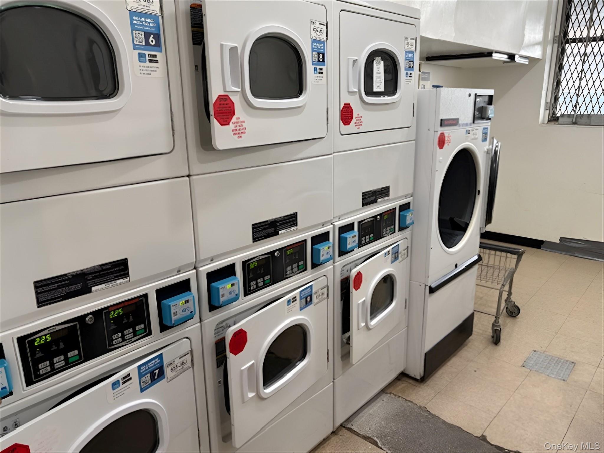 152-72 Melbourne Avenue, Unit 1D Queens, NY 11367 - Photo 10 of 14 a utility room with dryer and washer