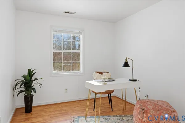 a workspace with furniture and window