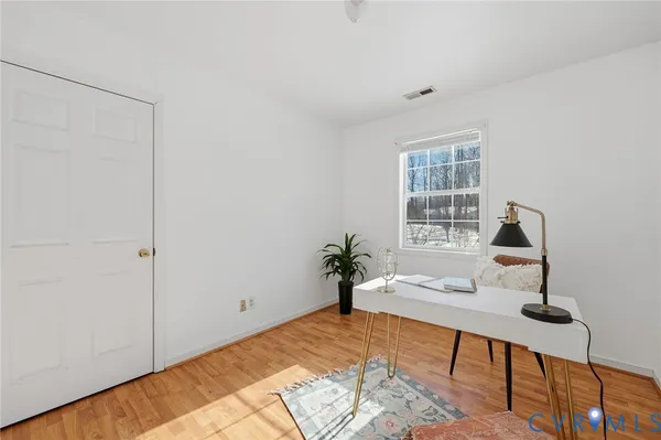 a workspace with furniture and a window