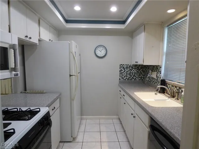 a bathroom with a sink a vanity and a mirror