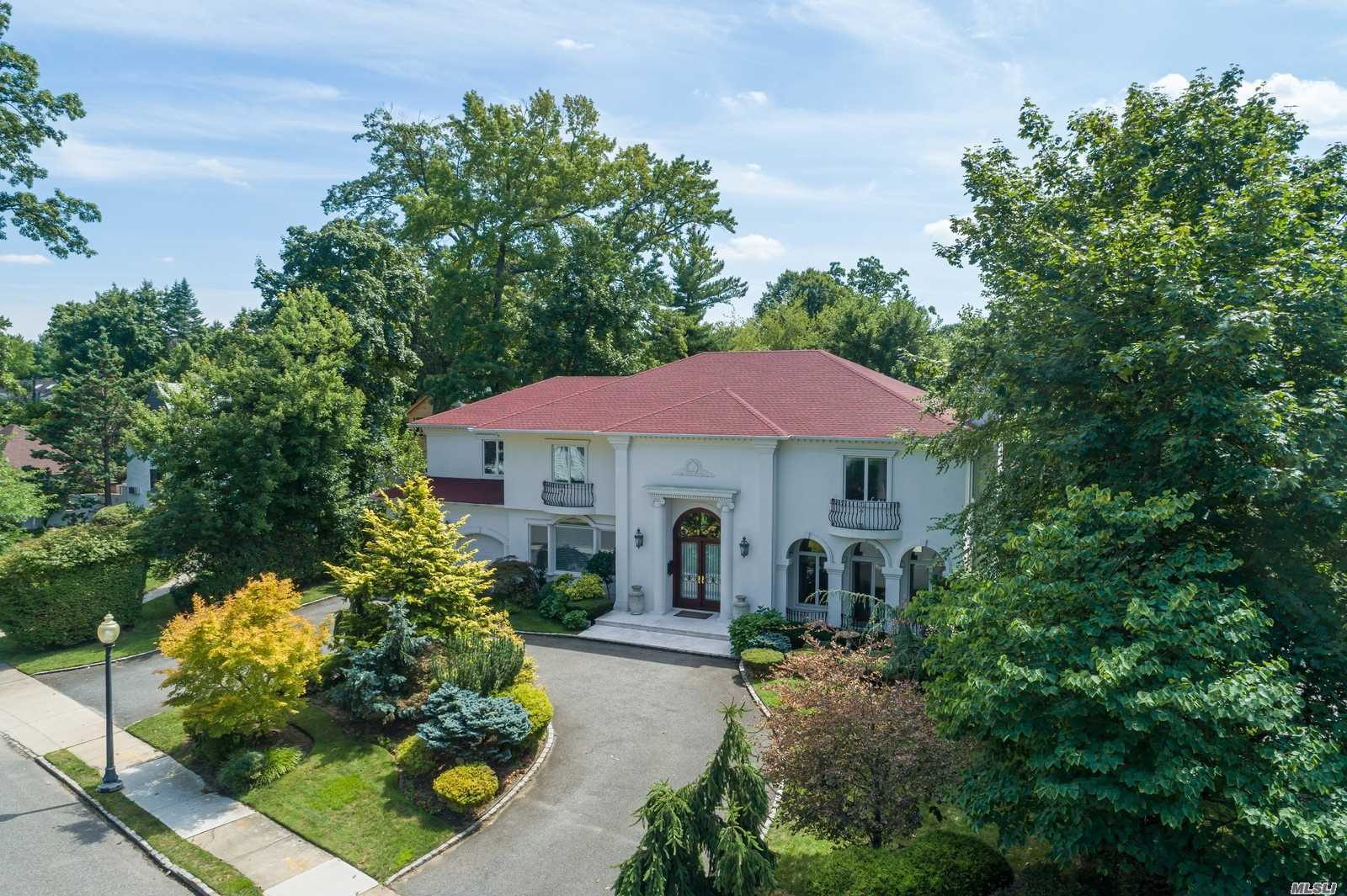 50 Arleigh Road Great Neck, NY 11021 - Photo 1 of 1 a front view of a house with a yard