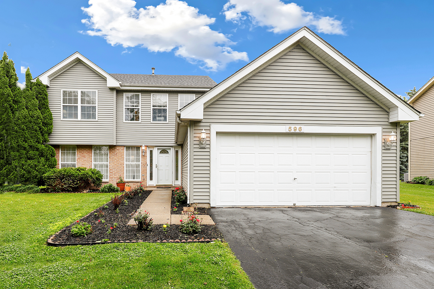 596 Buckboard Road Bolingbrook, IL 60490 - Photo 1 of 30 a front view of a house with a yard and garage