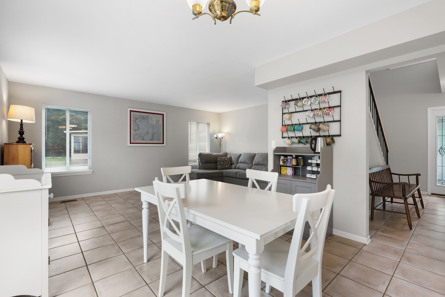 596 Buckboard Road Bolingbrook, IL 60490 - Photo 12 of 30 a view of a dining room with furniture and a potted plant
