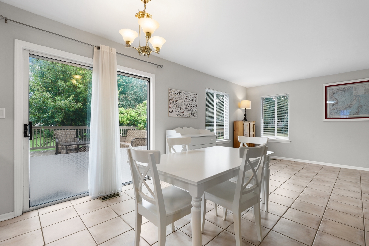 596 Buckboard Road Bolingbrook, IL 60490 - Photo 13 of 30 a dining room with furniture a chandelier and window