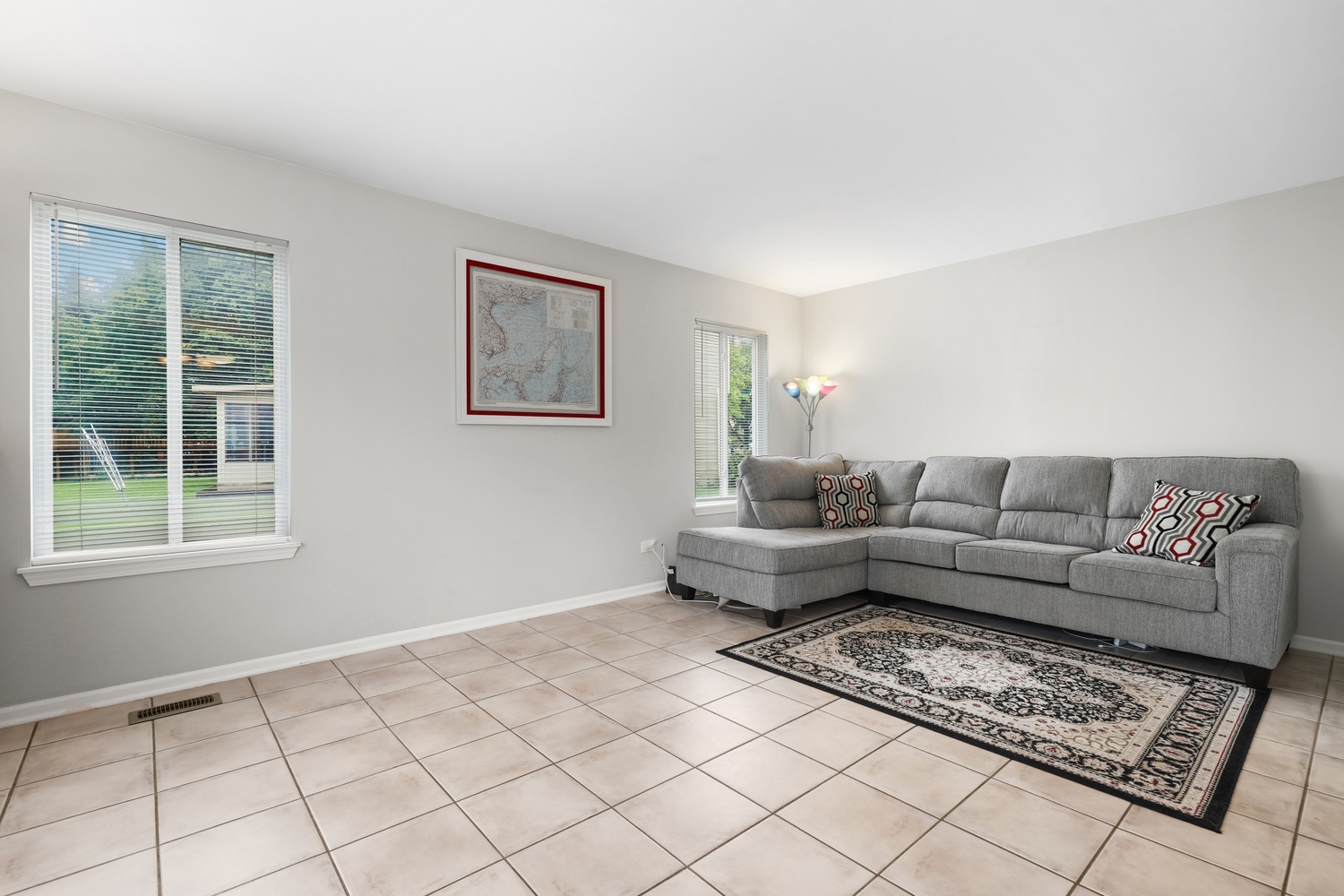 596 Buckboard Road Bolingbrook, IL 60490 - Photo 17 of 30 a living room with furniture and a window