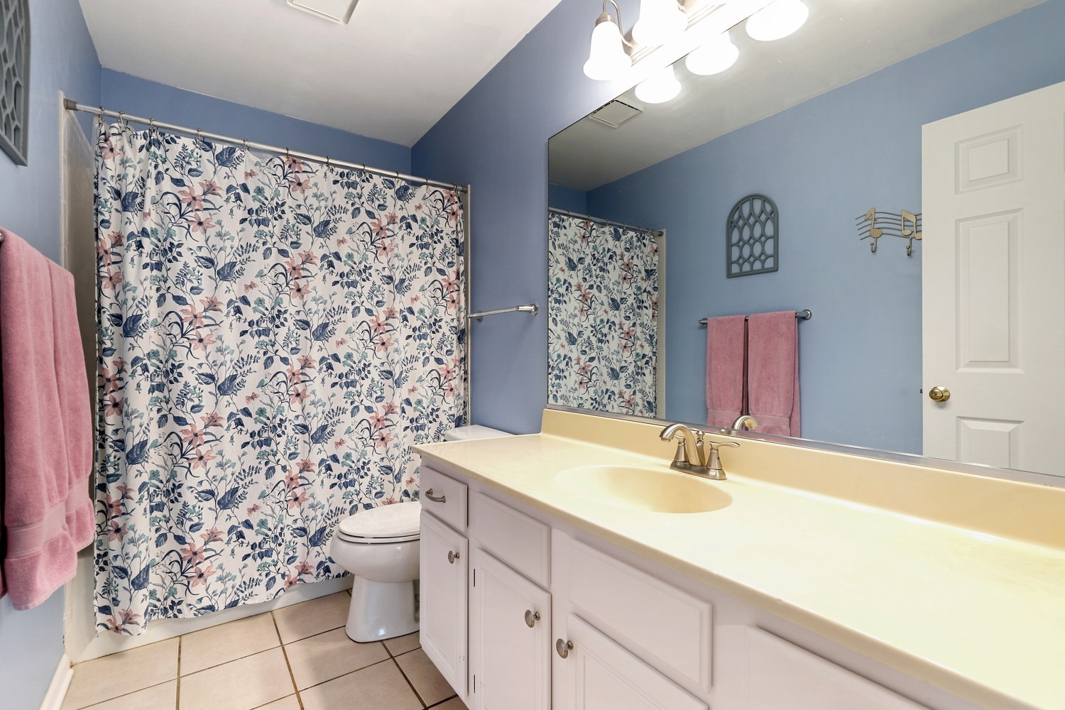 596 Buckboard Road Bolingbrook, IL 60490 - Photo 19 of 30 a bathroom with a sink toilet and shower