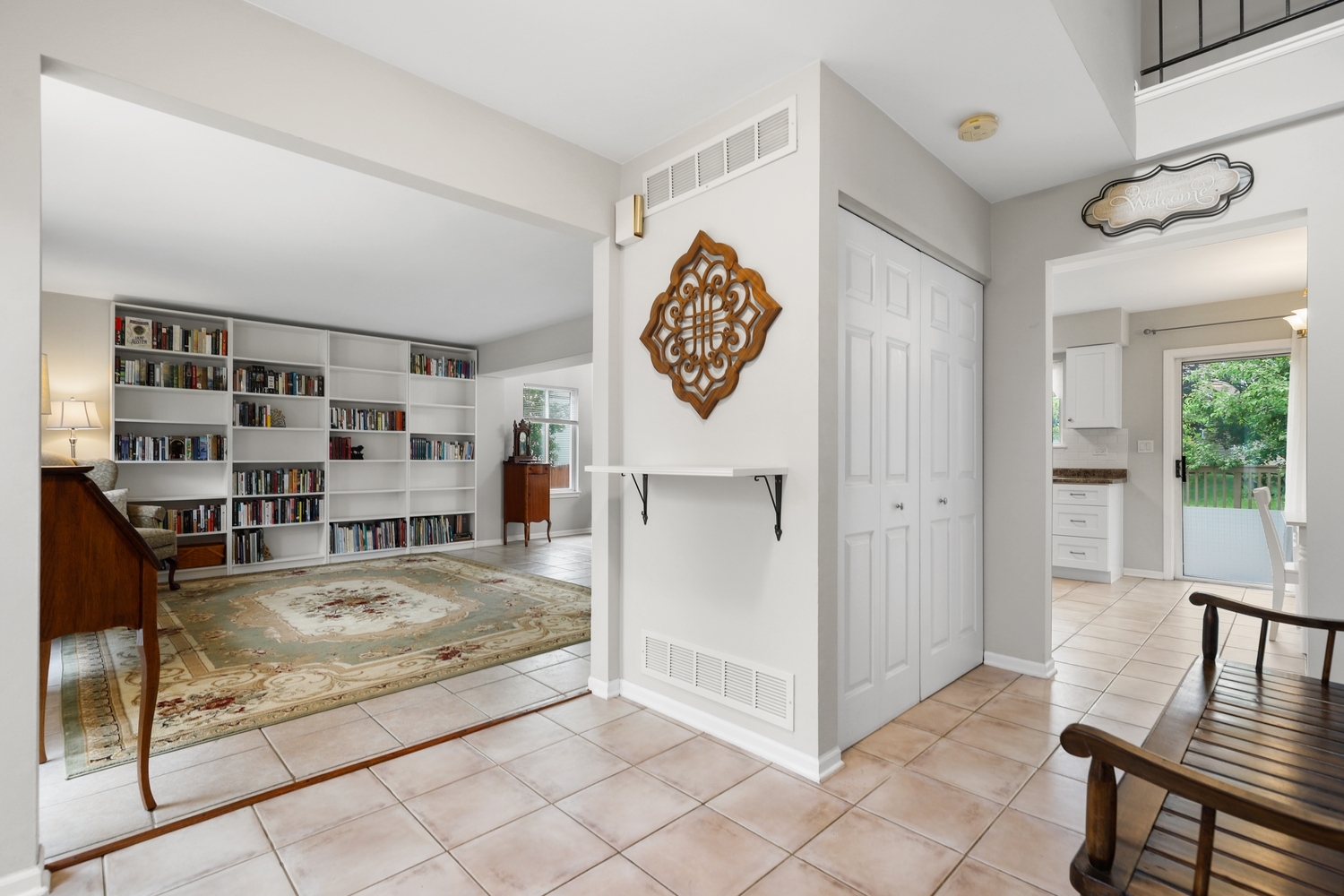 596 Buckboard Road Bolingbrook, IL 60490 - Photo 3 of 30 a view of a hallway to a livingroom with furniture and window