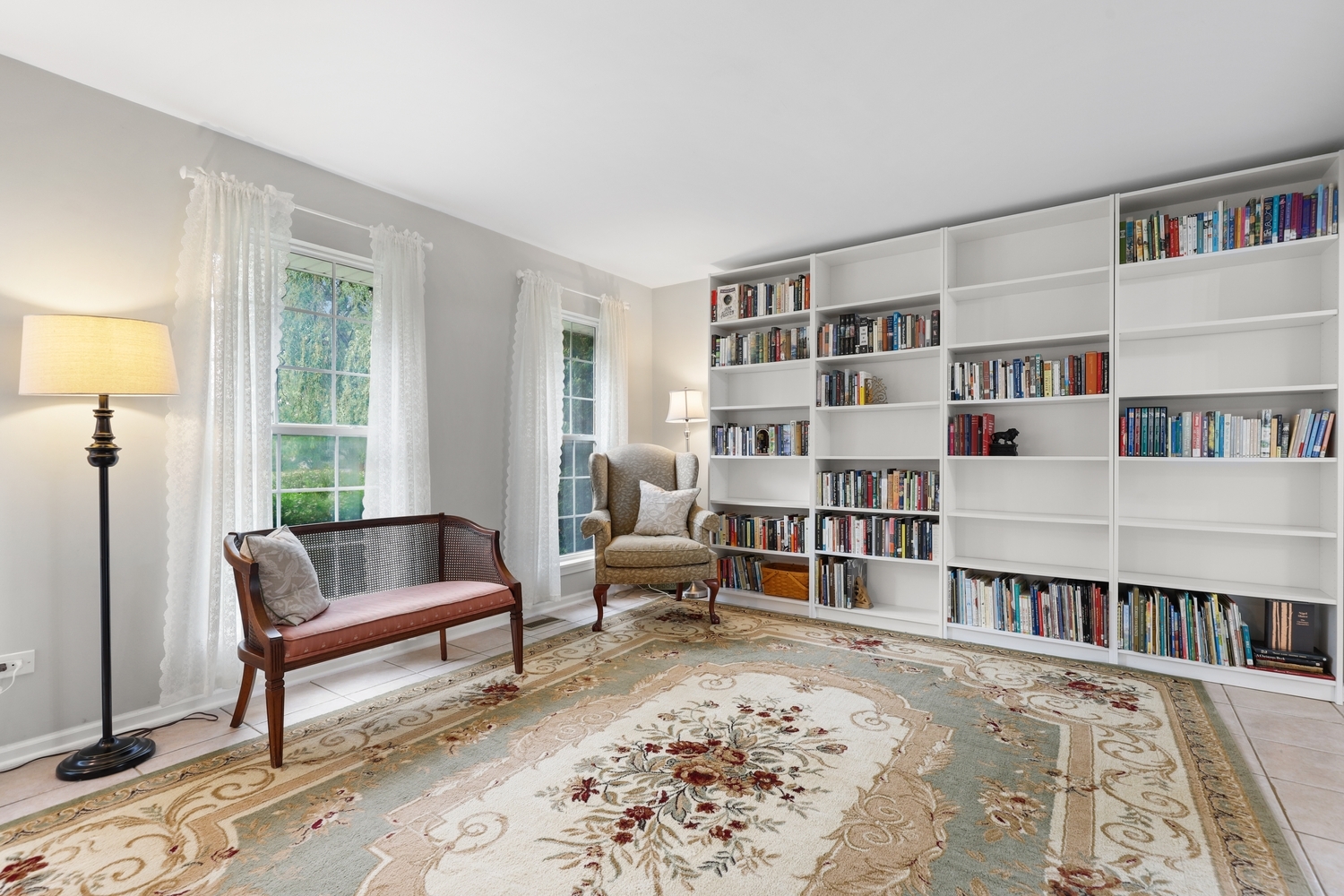 596 Buckboard Road Bolingbrook, IL 60490 - Photo 5 of 30 a living room with furniture and a book shelf