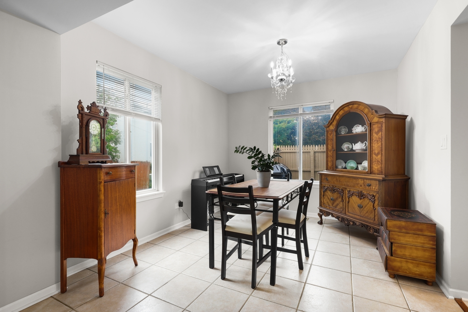 596 Buckboard Road Bolingbrook, IL 60490 - Photo 8 of 30 a view of a dining room with furniture and a chandelier