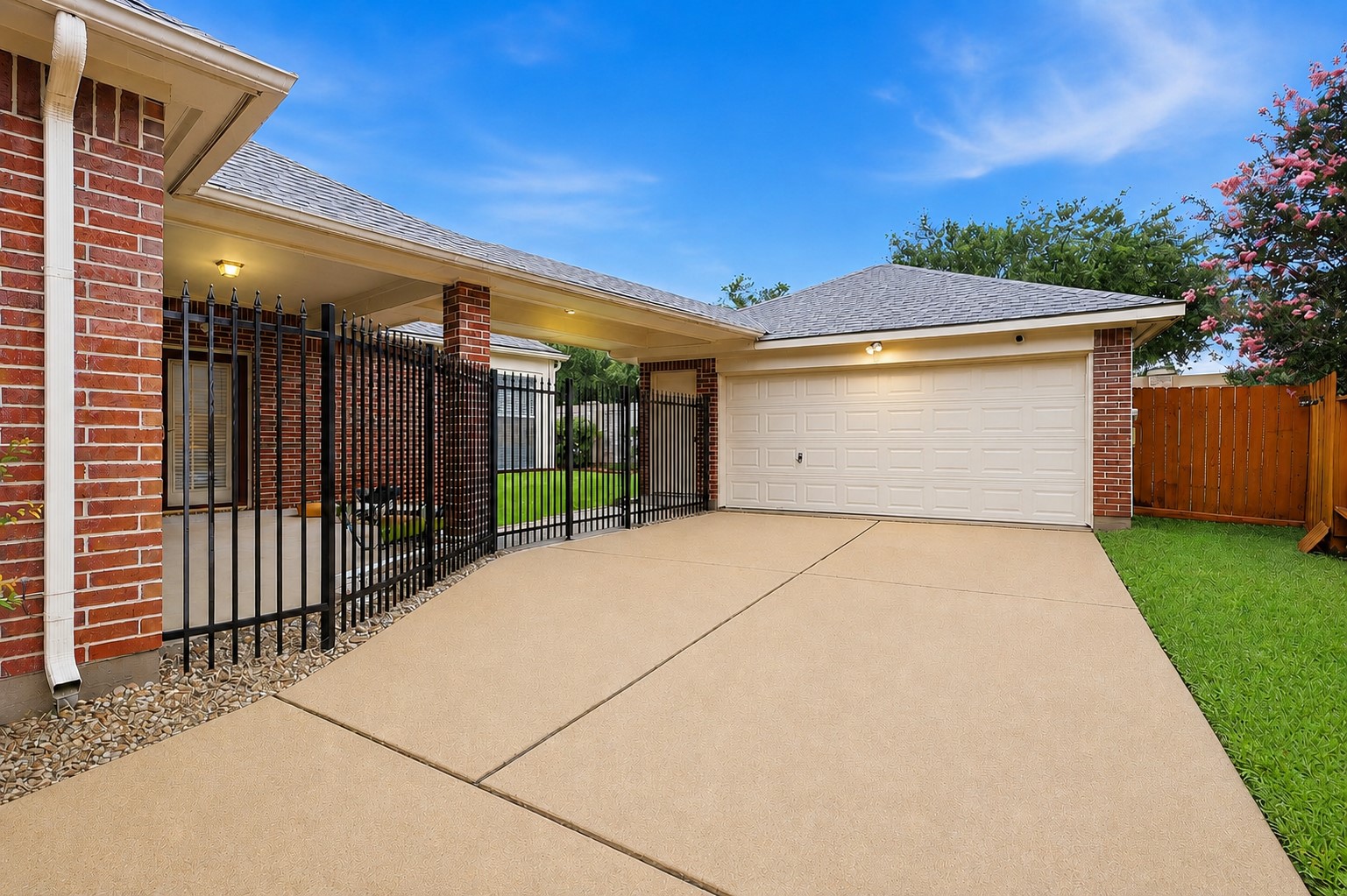 5815 Pheasant Ridge Lane Houston, TX 77041 - Photo 35 of 43 The elegant wrought-iron gated entrance provides both privacy and peace of mind while allowing you to easily see who is entering or outside your driveway. A perfect blend of security, style, and convenience!