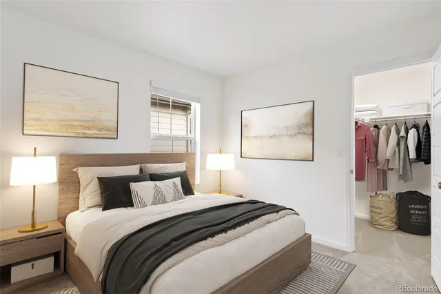 a bedroom with bed and wall painting