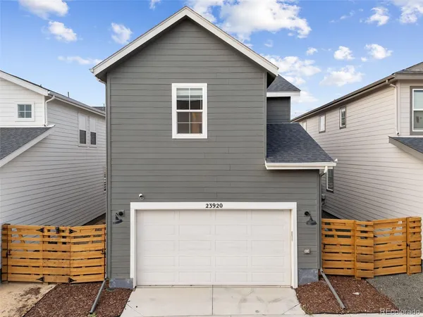 a front view of a house with a garage