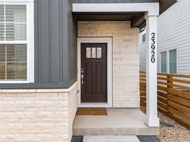 a front view of a house with a gate