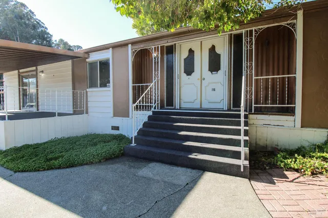 a view of a lounge chairs in front of retail shop