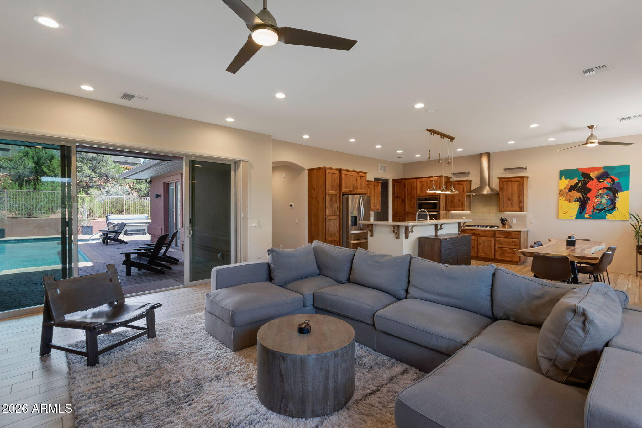 90 Rimstone Circle Sedona, AZ 86336 - Photo 6 of 27 Living Room_Pool_Kitchen