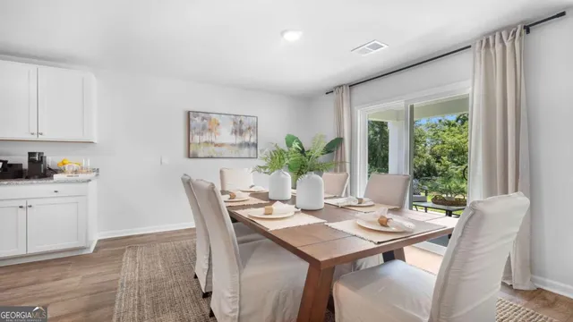 a view of a dining room with furniture window and outside view
