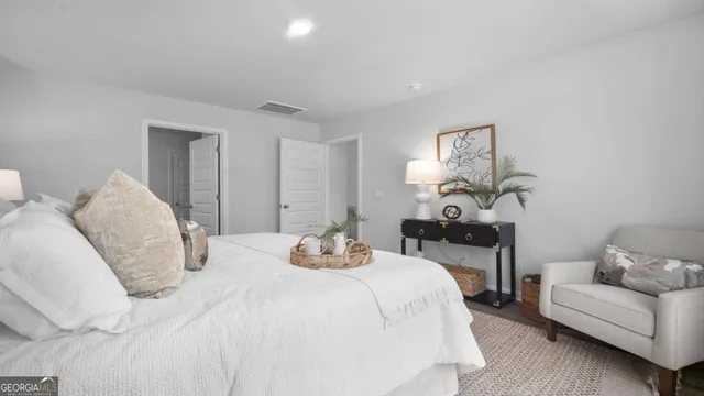 a bedroom with a bed and a couch