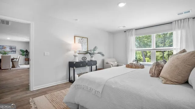 a bedroom with a bed and a table