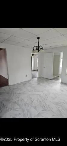 a view of wooden floor in kitchen