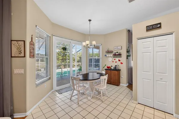 a bathroom with a granite countertop tub a double vanity sink a two mirror and a window