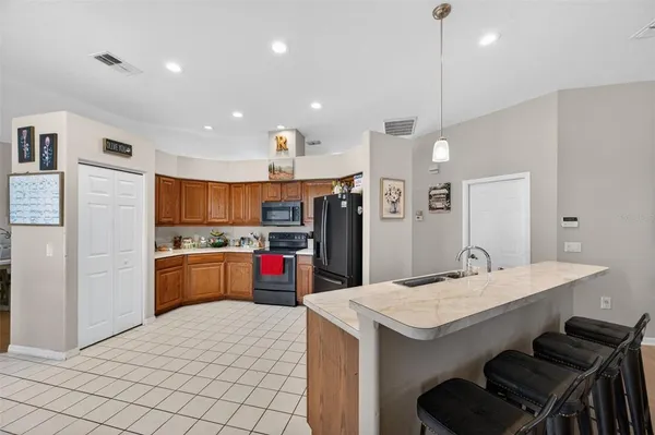 a bedroom with furniture and a flat screen tv