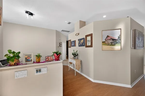 a living room with stainless steel appliances kitchen island granite countertop furniture and a view of kitchen