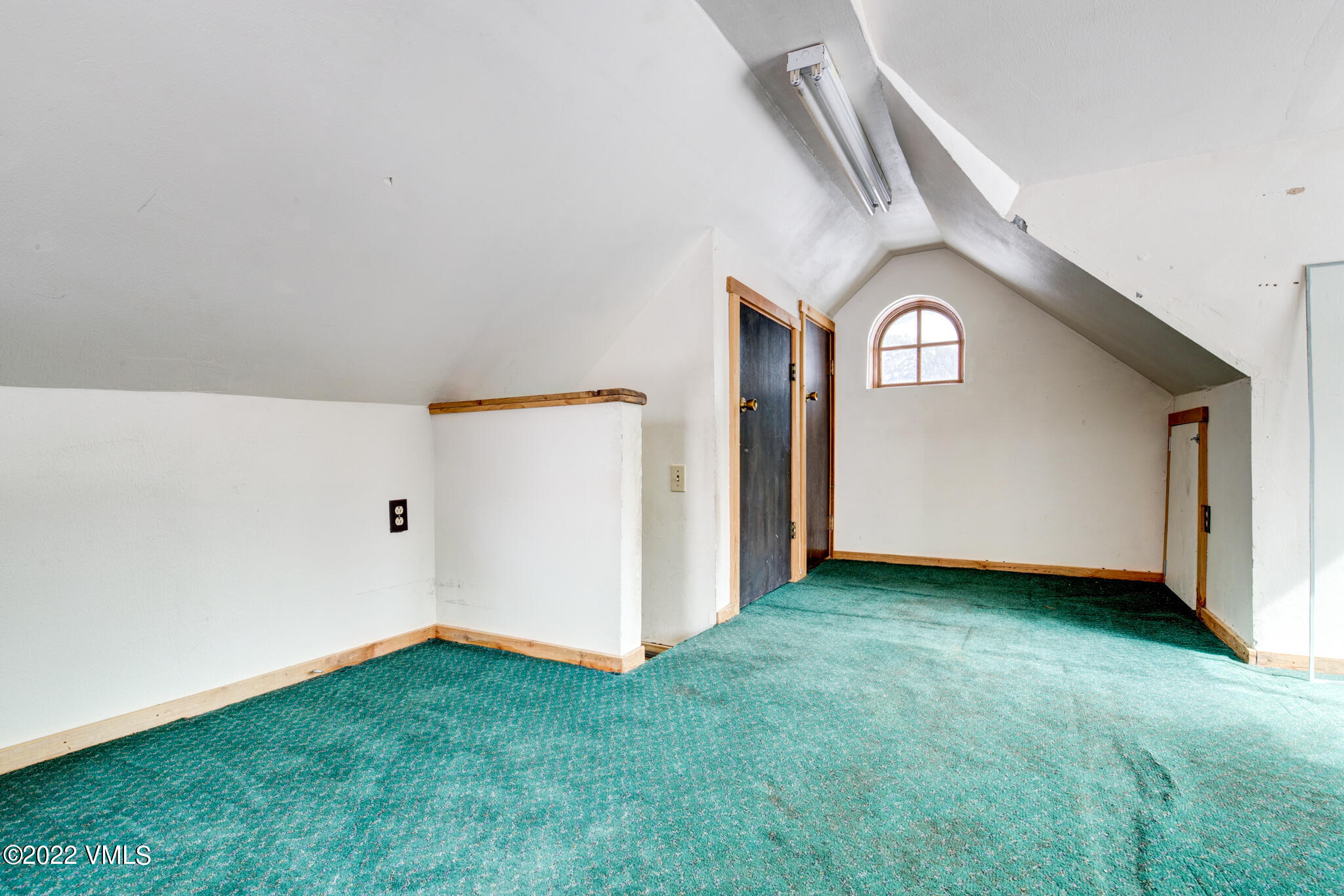 383 Pine Street Red Cliff, CO 81649 - Photo 13 of 31 an empty room with a window and a kitchen