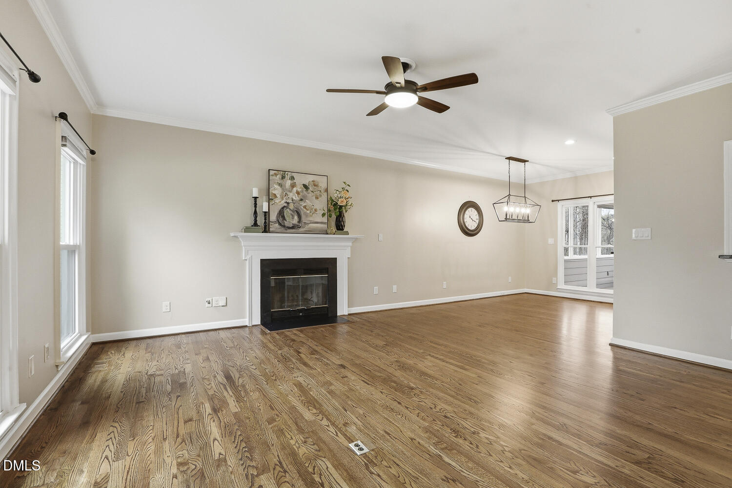 2717 Rockbridge Court Raleigh, NC 27604 - Photo 2 of 16 a view of empty room with wooden floor and fireplace