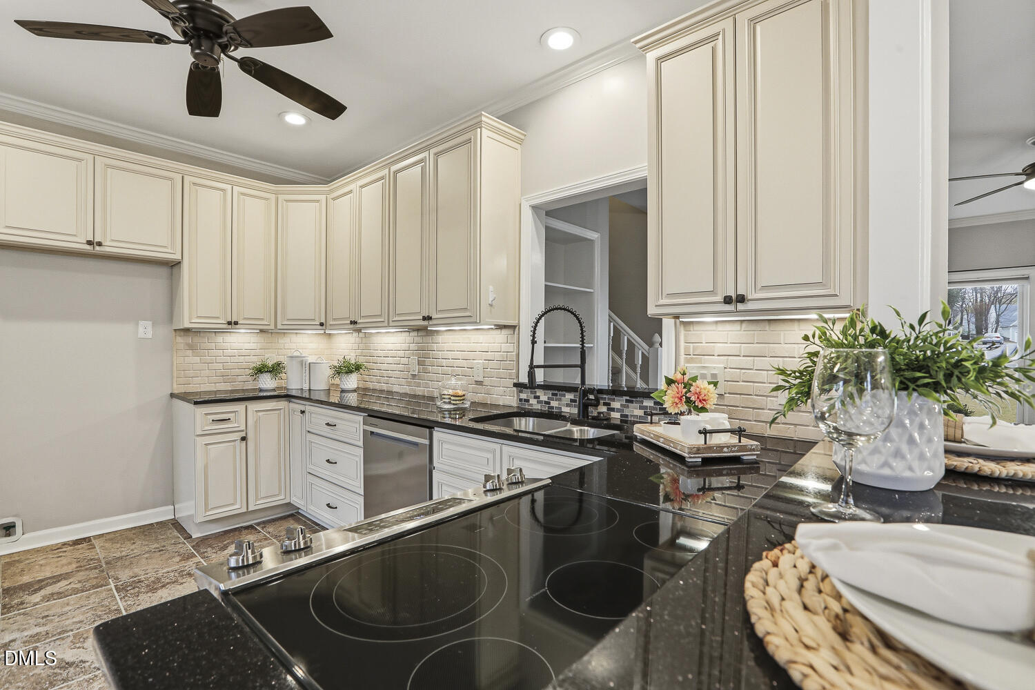 2717 Rockbridge Court Raleigh, NC 27604 - Photo 6 of 16 a kitchen with sink a stove and chairs