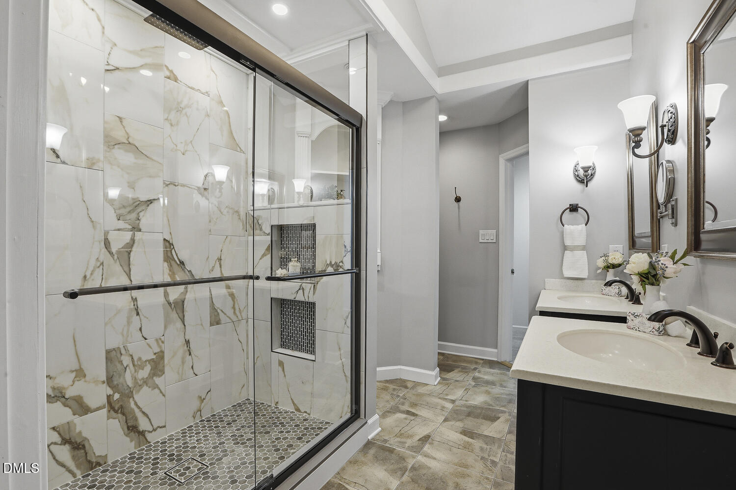 2717 Rockbridge Court Raleigh, NC 27604 - Photo 7 of 16 a bathroom with a sink a mirror and shower
