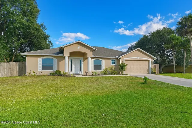 a kitchen with granite countertop a sink and a stove