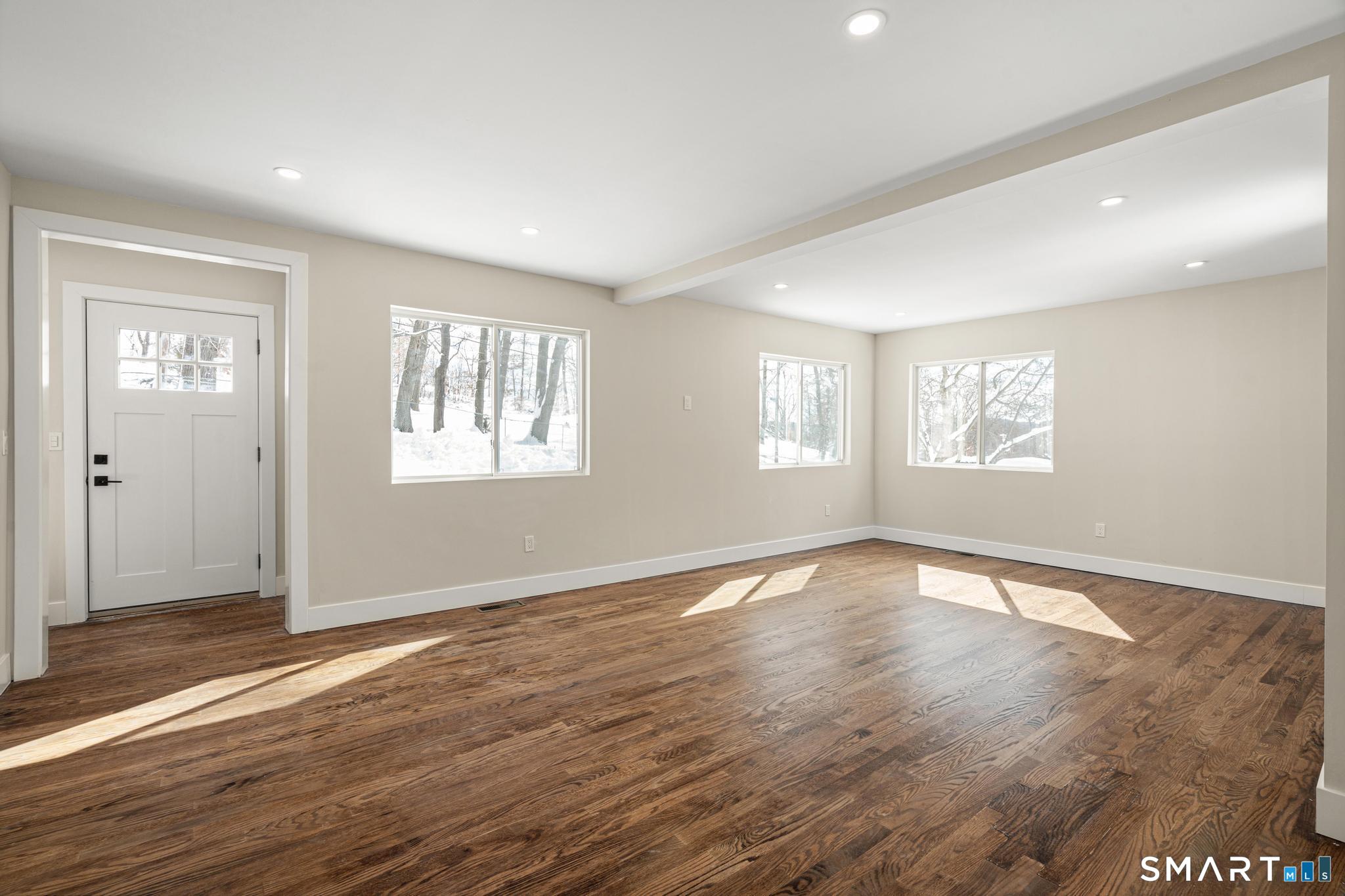 6 Juniper Ridge Drive Danbury, CT 06811 - Photo 7 of 36 a view of an empty room with wooden floor and window