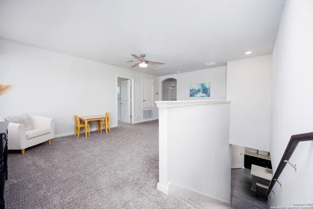 a view of livingroom with furniture and workspace