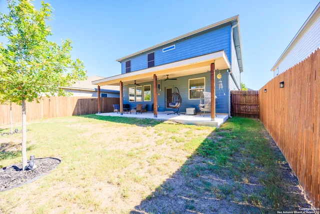 a view of a house with a yard patio and yard