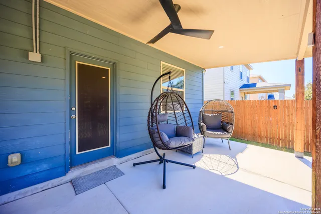 a view of a swimming pool with an outdoor space and seating area