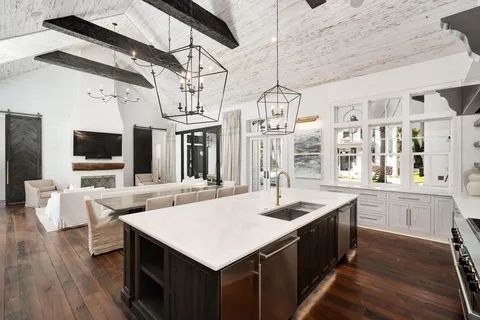 a kitchen with a stove and a sink