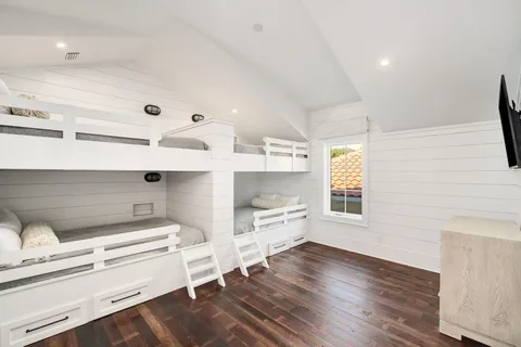 a bedroom with a large bed and a large window