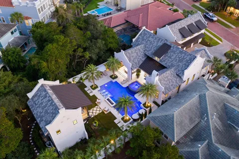 an aerial view of a house with a yard