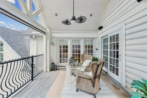 a view of a patio with a table and chairs
