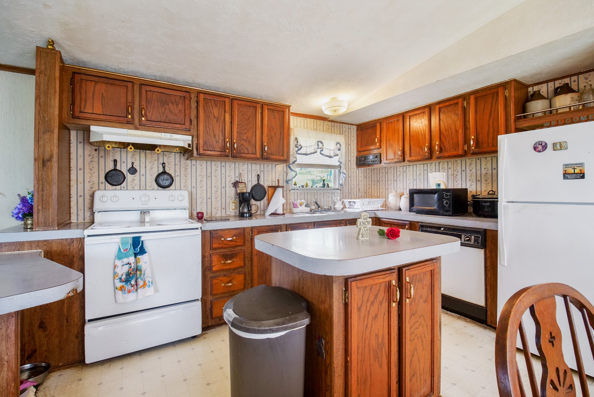3925 Mobley's Cut Road Columbia, TN 38401 - Photo 14 of 31 a kitchen with a sink a stove and a refrigerator