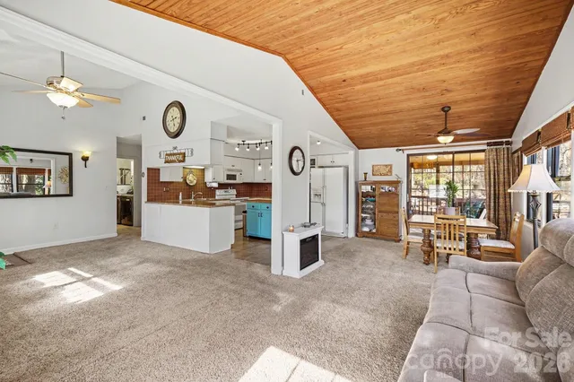 a view of a livingroom with furniture and windows