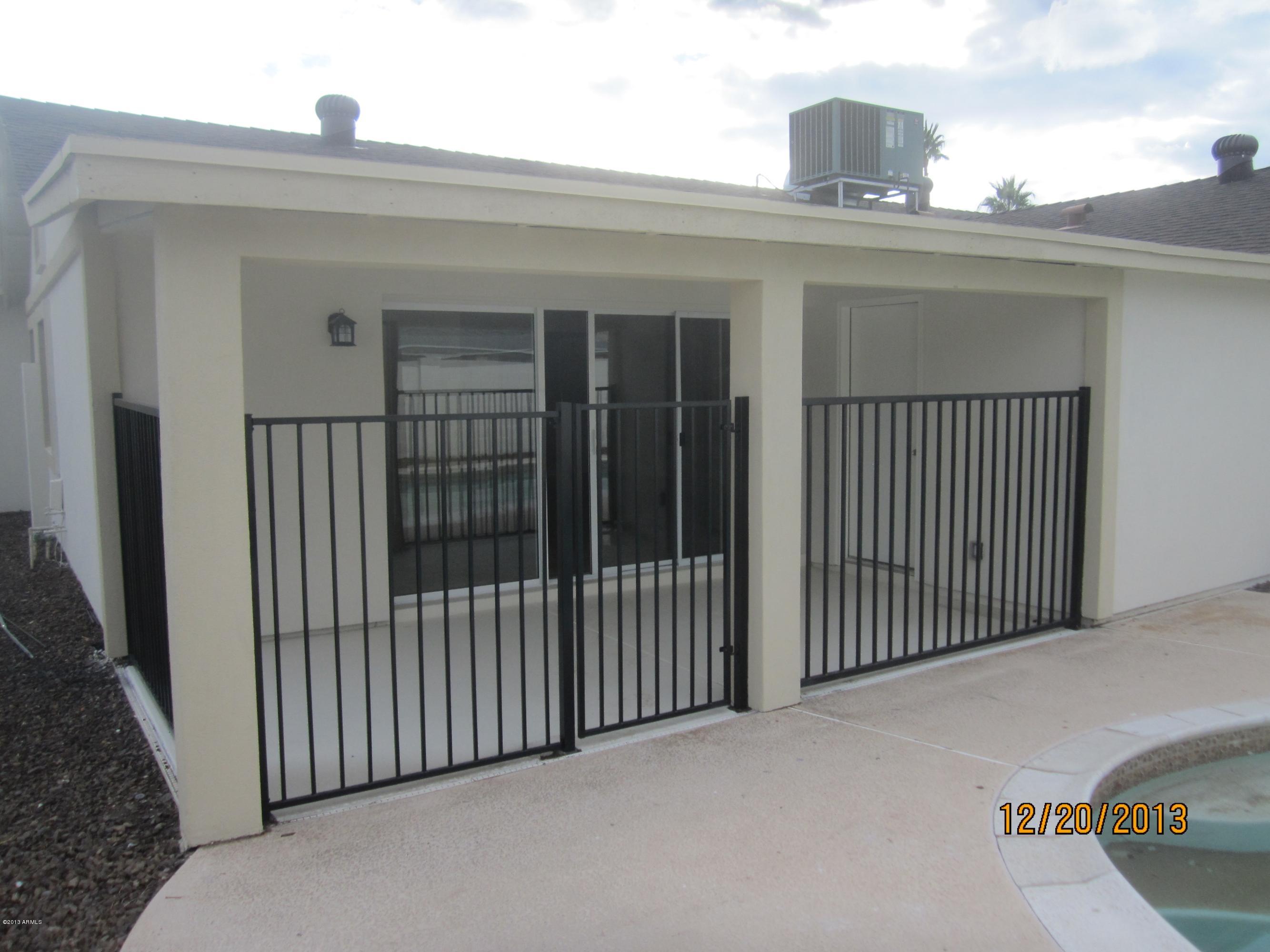 5606 West Hatcher Road Glendale, AZ 85302 - Photo 16 of 18 Pool Fence and covered patio
