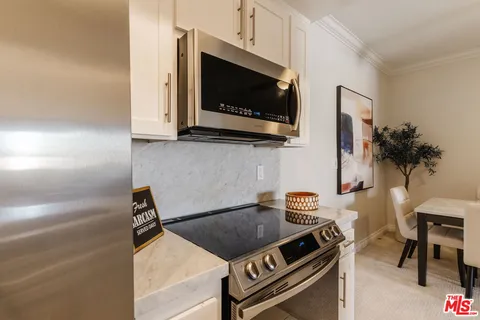 a kitchen with a stove and a microwave